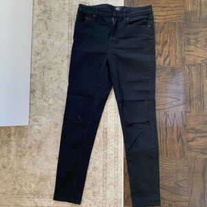 BDG black skinny jeans with rip at knees
